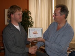 Adriaan (left) receives the Zimbu Award from Bram